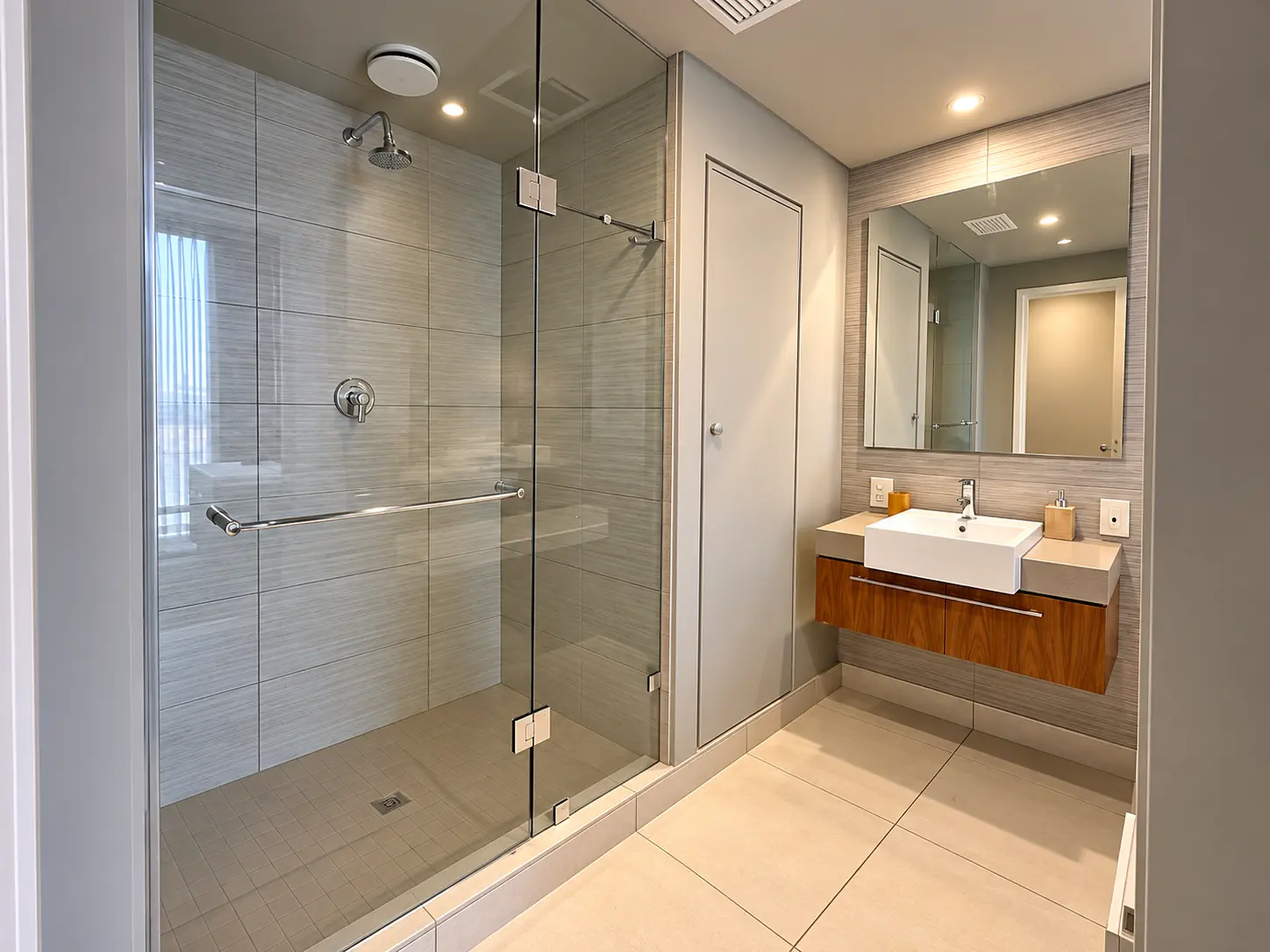 Walk-in shower and modern bathroom vanity